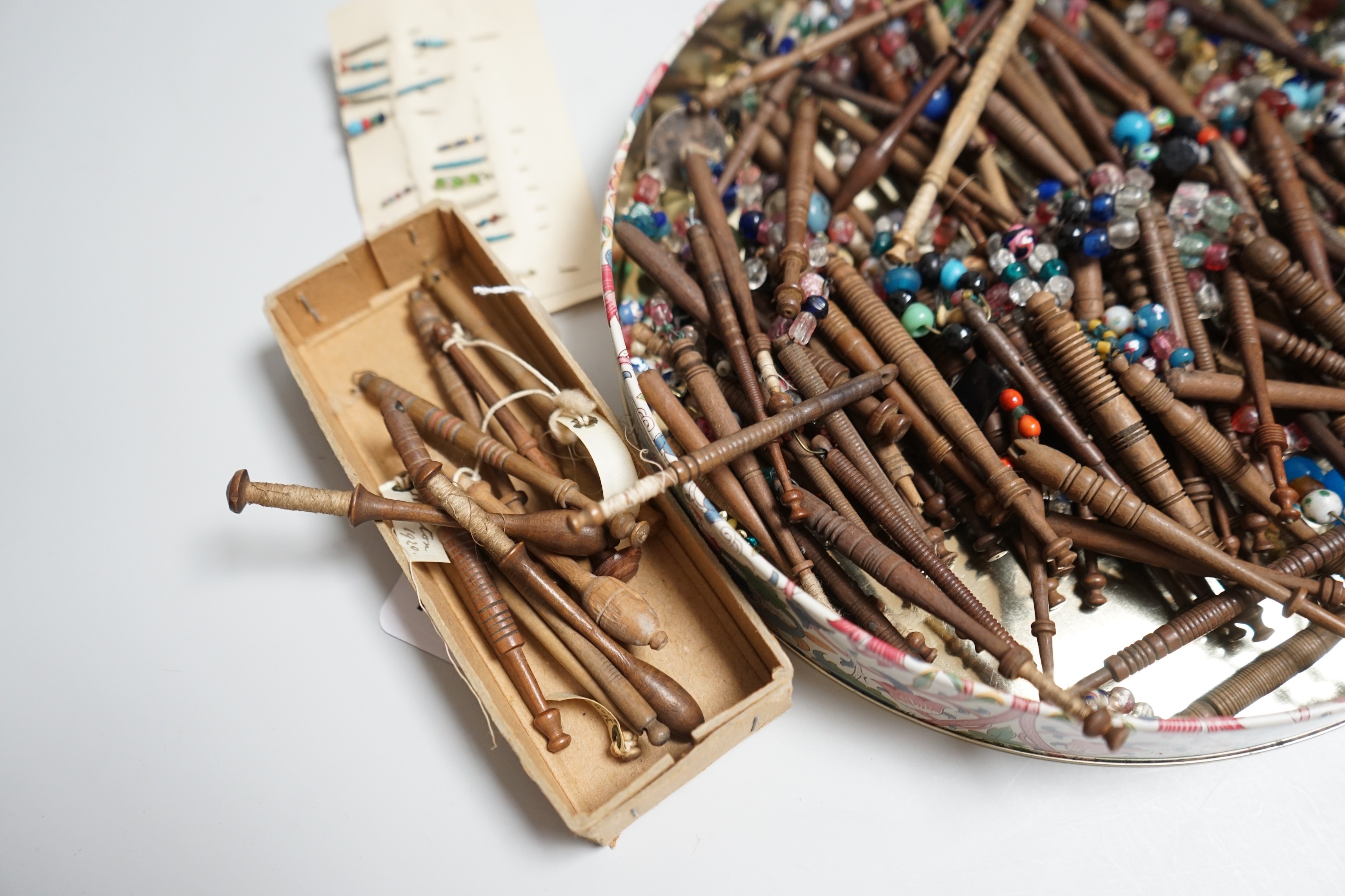 One hundred 19th century turned lace bobbins, plus various broken bobbins and spare beading